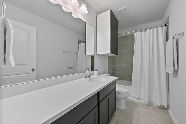 bathroom with shower / tub combo, visible vents, toilet, tile patterned floors, and vanity