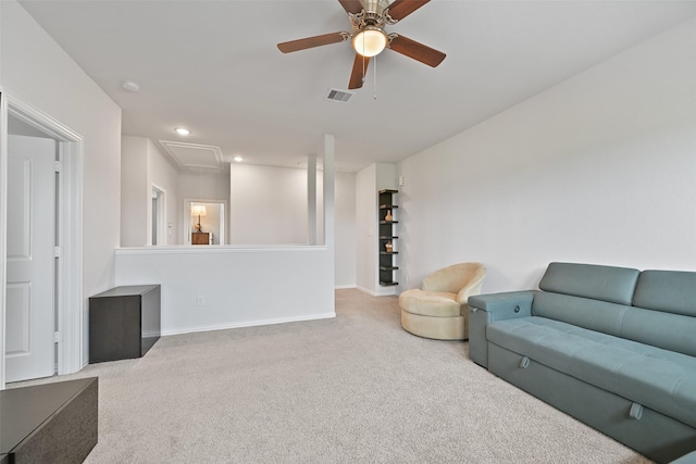 carpeted living room with recessed lighting, visible vents, attic access, a ceiling fan, and baseboards