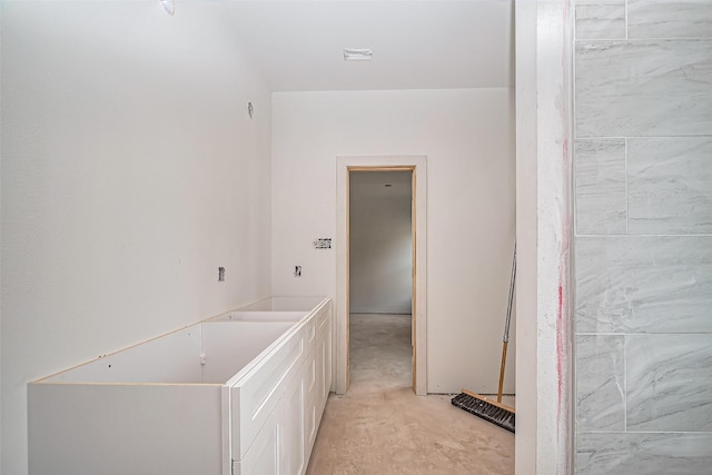 bathroom with unfinished concrete flooring