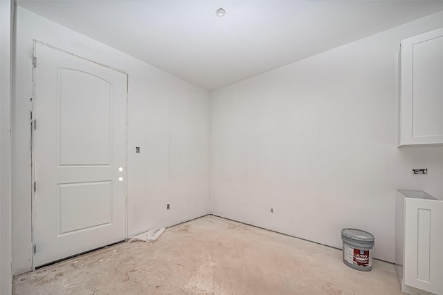 unfurnished room featuring unfinished concrete floors