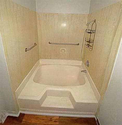 full bathroom with a bathtub and walk in shower