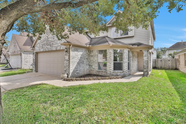 view of front of home with driveway, brick siding, and a front yard