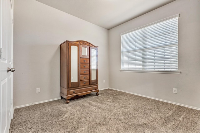 carpeted bedroom with baseboards