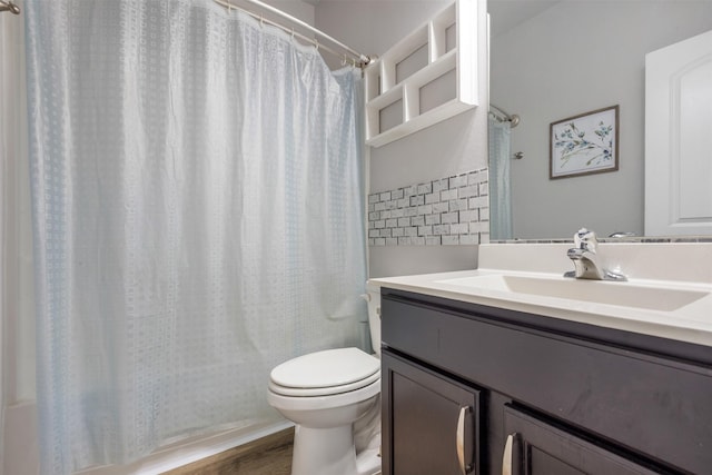 full bathroom with shower / bath combination with curtain, wood finished floors, vanity, and toilet