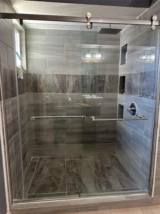 bathroom featuring a stall shower