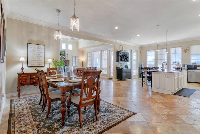 dining area featuring a healthy amount of sunlight, a ceiling fan, crown molding, and recessed lighting