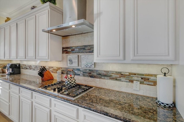 kitchen with stainless steel gas cooktop, wall chimney exhaust hood, and backsplash