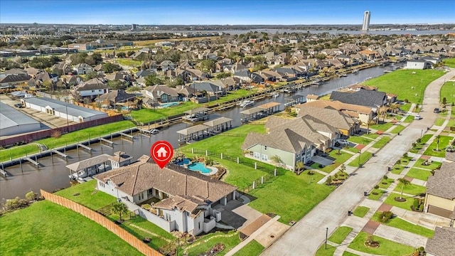 drone / aerial view featuring a water view and a residential view