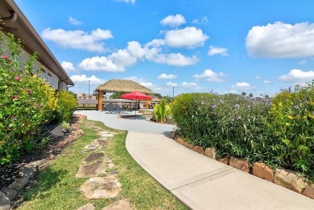 view of yard with a gazebo, a patio, and fence