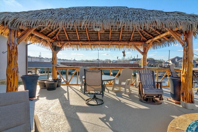 view of patio with outdoor dining area and a gazebo