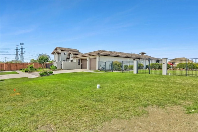 view of front of property featuring concrete driveway, a tile roof, an attached garage, fence, and a front lawn