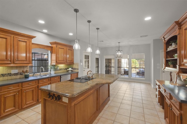 kitchen featuring dark countertops, a kitchen island, a sink, black electric cooktop, and stainless steel dishwasher