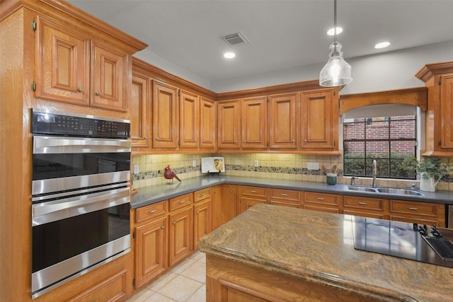 kitchen featuring visible vents, decorative backsplash, stainless steel double oven, a sink, and light tile patterned flooring