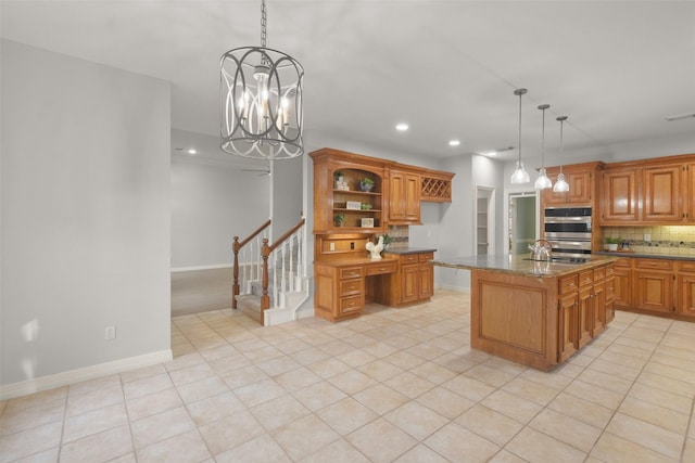 kitchen featuring brown cabinets, built in desk, open shelves, decorative backsplash, and baseboards