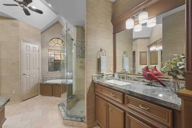 full bathroom with a ceiling fan, tile patterned floors, vaulted ceiling, vanity, and a shower stall