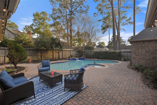 view of pool featuring a patio, a fenced backyard, a fenced in pool, and an in ground hot tub