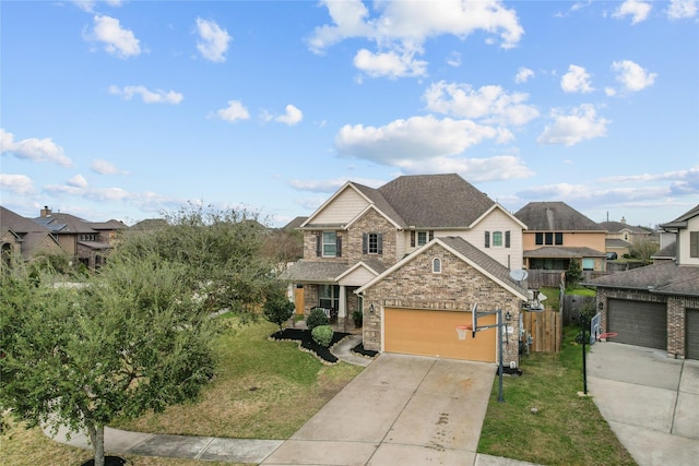 traditional-style home with a garage, concrete driveway, roof with shingles, a front yard, and brick siding