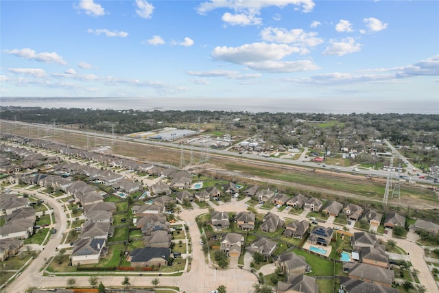 bird's eye view featuring a residential view and a water view