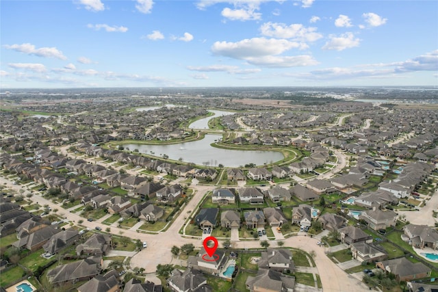 aerial view with a residential view and a water view