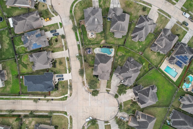 birds eye view of property with a residential view