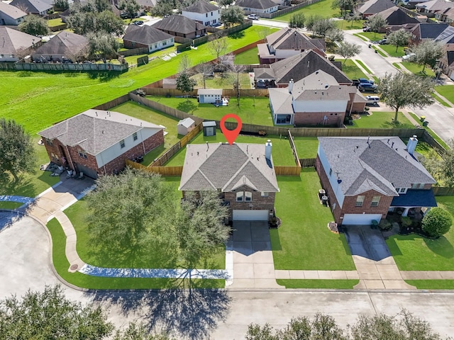 birds eye view of property with a residential view