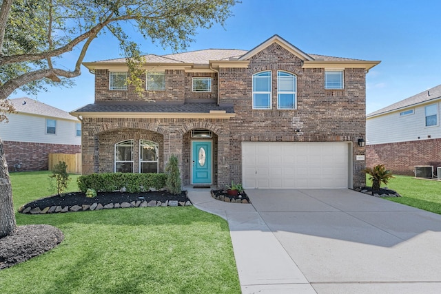 traditional home with brick siding, concrete driveway, an attached garage, central AC, and a front lawn