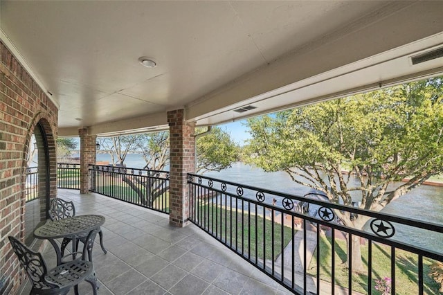 balcony featuring a water view