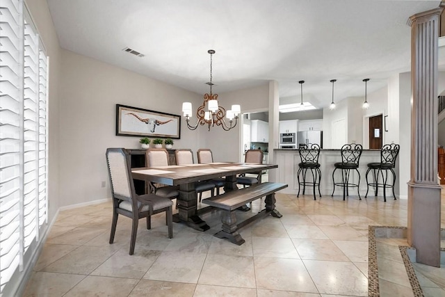 dining area with visible vents, vaulted ceiling, baseboards, and an inviting chandelier