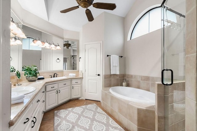 full bathroom with tile patterned flooring, a sink, a bath, double vanity, and a stall shower