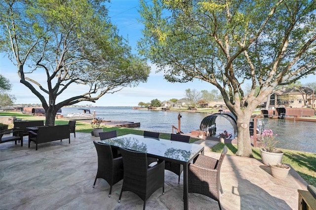 view of patio / terrace featuring outdoor dining area and a water view