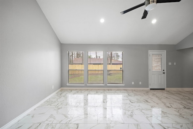 unfurnished room featuring lofted ceiling, marble finish floor, recessed lighting, and baseboards