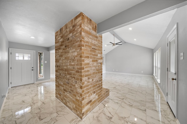 foyer with a ceiling fan, marble finish floor, vaulted ceiling with beams, and baseboards