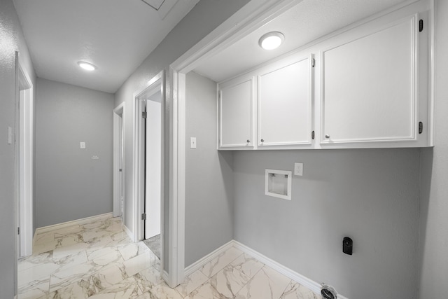 laundry room with marble finish floor, hookup for a washing machine, cabinet space, and baseboards