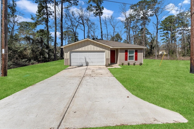 view of front of property with an attached garage, driveway, board and batten siding, and a front yard