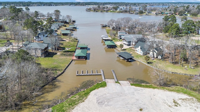 drone / aerial view with a water view and a residential view