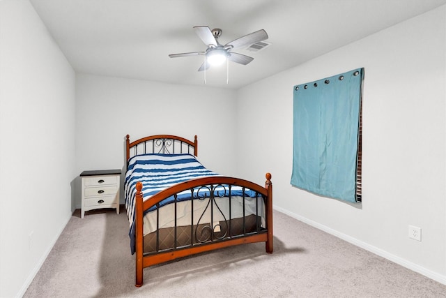 bedroom featuring ceiling fan, carpet flooring, and baseboards