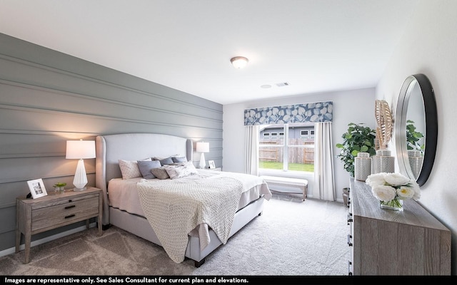 carpeted bedroom with visible vents