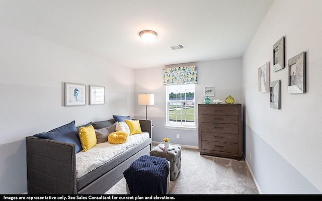 carpeted living room featuring baseboards and visible vents