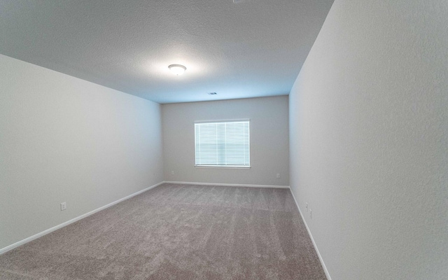 8125 Coral Dr, Texas City, TX 77591 - empty room featuring carpet flooring and baseboards