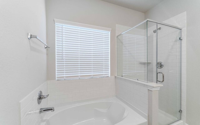 8125 Coral Dr, Texas City, TX 77591 - bathroom featuring a bath and a stall shower