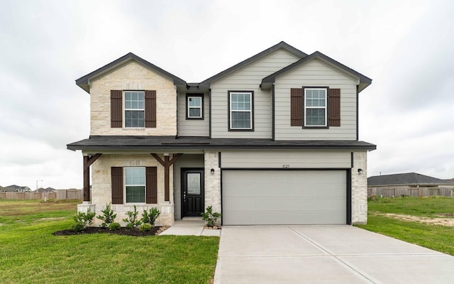8125 Coral Dr, Texas City, TX 77591 - view of front facade with driveway, a garage, a front lawn, and stone siding