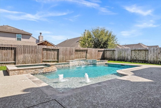 view of swimming pool with a fenced backyard and a pool with connected hot tub