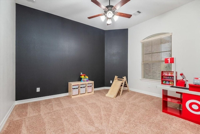 playroom with baseboards, visible vents, ceiling fan, and carpet flooring