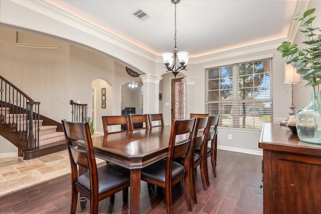 dining area with stairway, ornate columns, ornamental molding, arched walkways, and visible vents