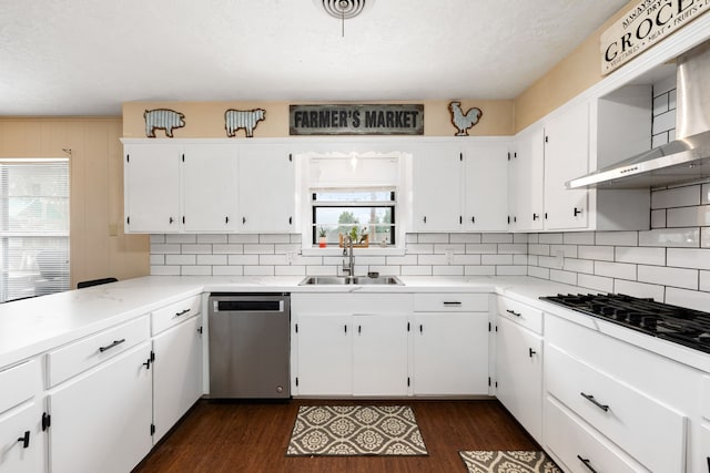 kitchen featuring black cooktop, dark wood-type flooring, a sink, dishwasher, and exhaust hood