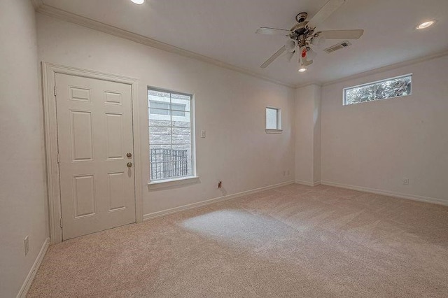 unfurnished room with light carpet, ceiling fan, and ornamental molding