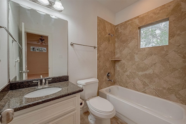 bathroom featuring toilet, shower / washtub combination, and vanity