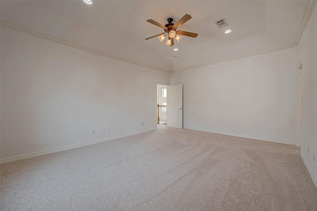 empty room featuring carpet floors, baseboards, visible vents, and ornamental molding