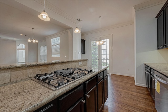 kitchen with decorative light fixtures, appliances with stainless steel finishes, dark wood-type flooring, and ornamental molding