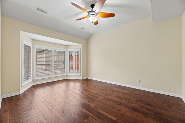 unfurnished room featuring ceiling fan, dark wood-style flooring, visible vents, and baseboards